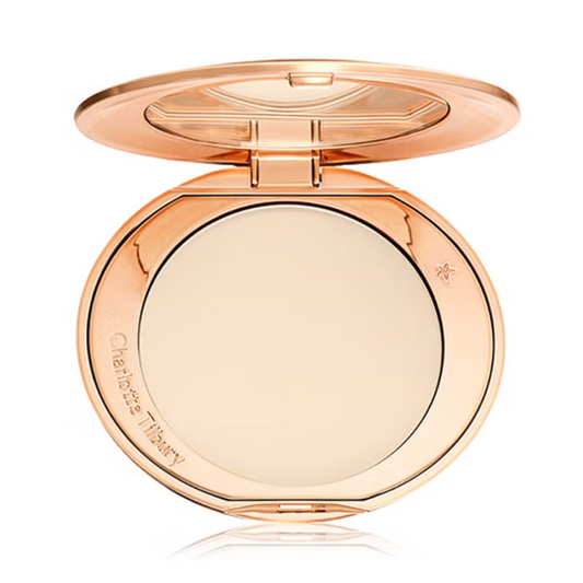Compact powder in a rose gold case on a white background