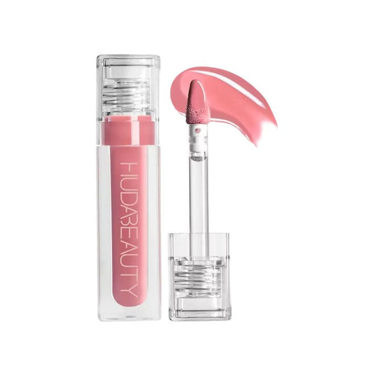 Pink lip gloss with clear case on a white background, featuring the brand 'HUDA BEAUTY'.